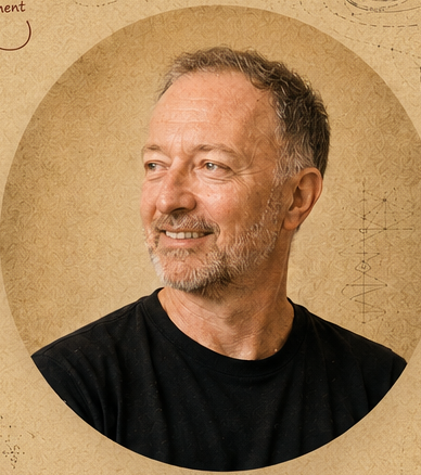 Guy Levy-Yurista in a black T-shirt, looking to the side and smiling.